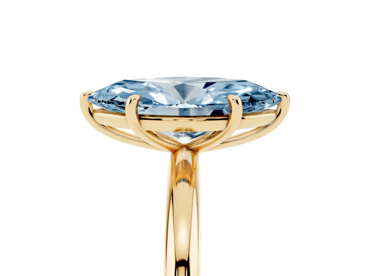 Fancy Blue Oval Cut Solitaire Diamond Ring with Four-Prong Setting on a Plain Band Yellow gold