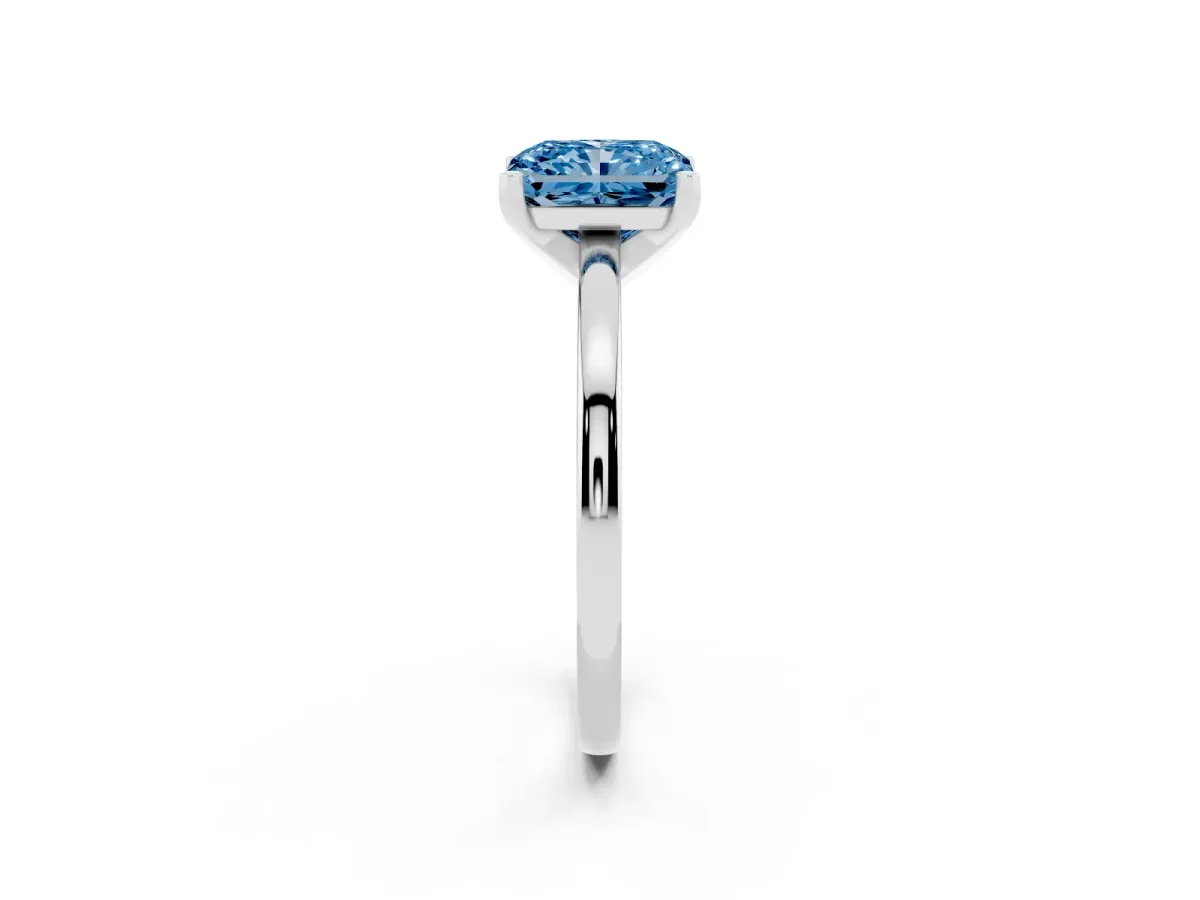 Fancy Blue Radiant Cut Solitaire Diamond Engagement Ring with Four-Prong Setting on a Classic Band Platinum