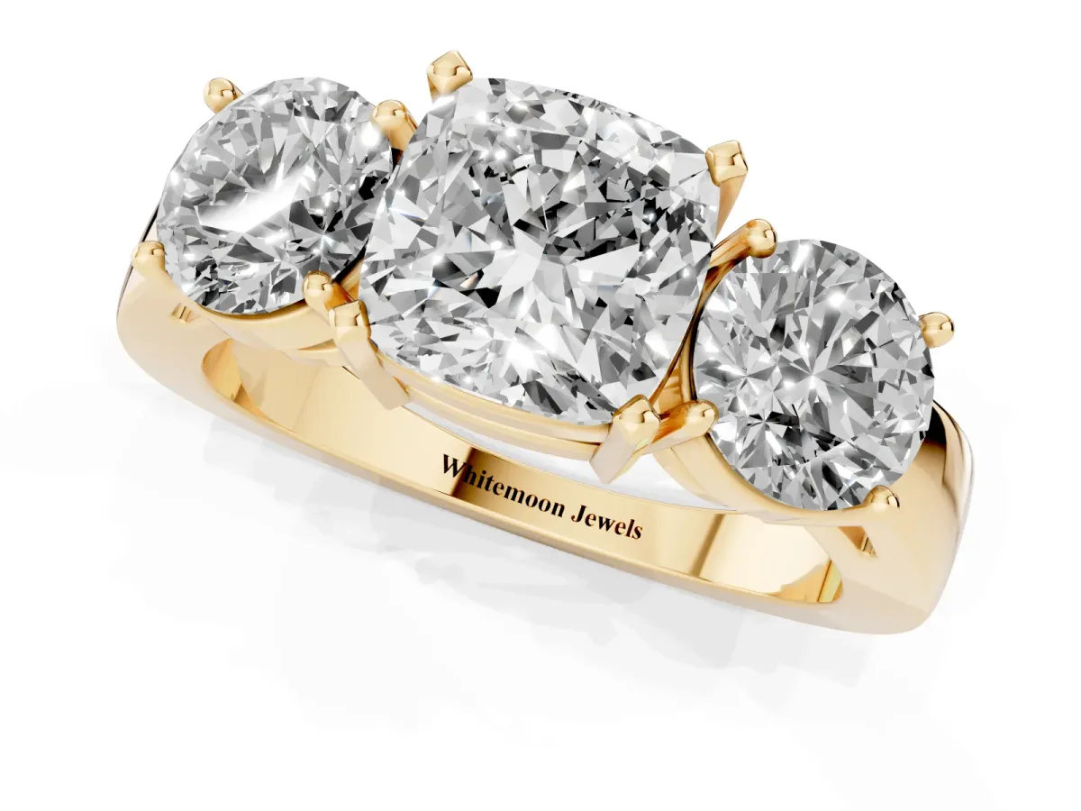 Three-Stone Cushion Cut Diamond Ring with Round Side Stones, Classic Band, and Four-Prong Setting Yellow gold