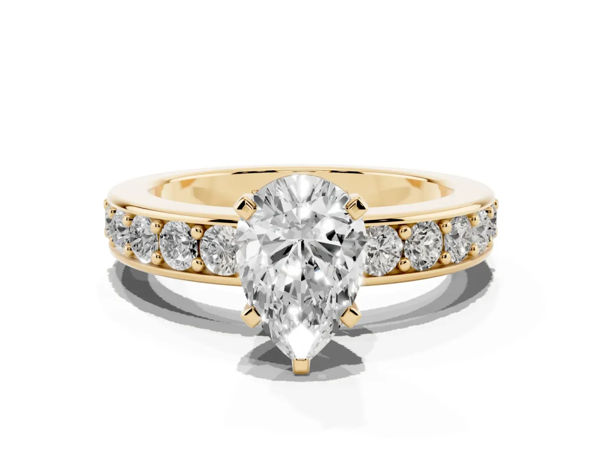 Pear Cut Diamond Engagement Ring with Channel Set Round Band and Prong Setting Yellow gold