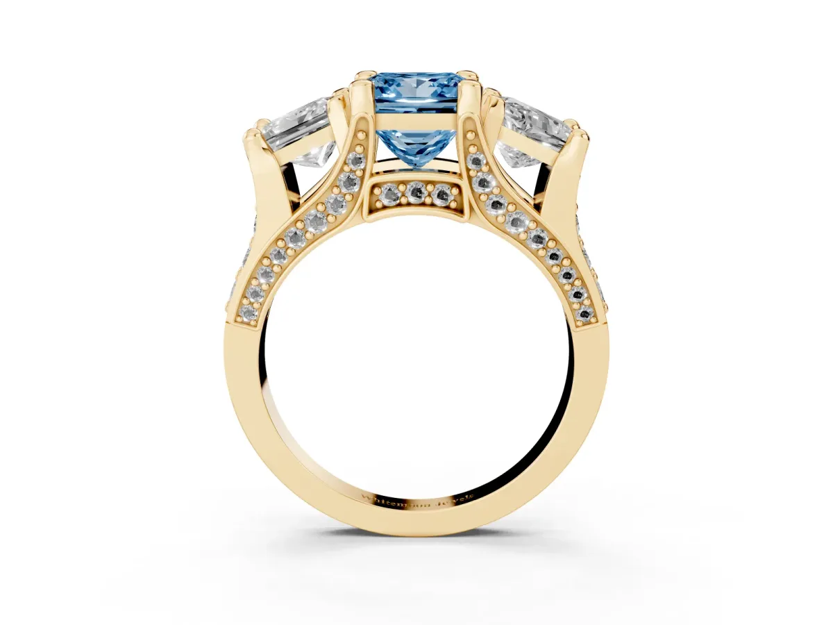 Fancy Blue Princess Cut Diamond Three-Stone Ring with Channel Set Band and Four-Prong Setting Yellow gold
