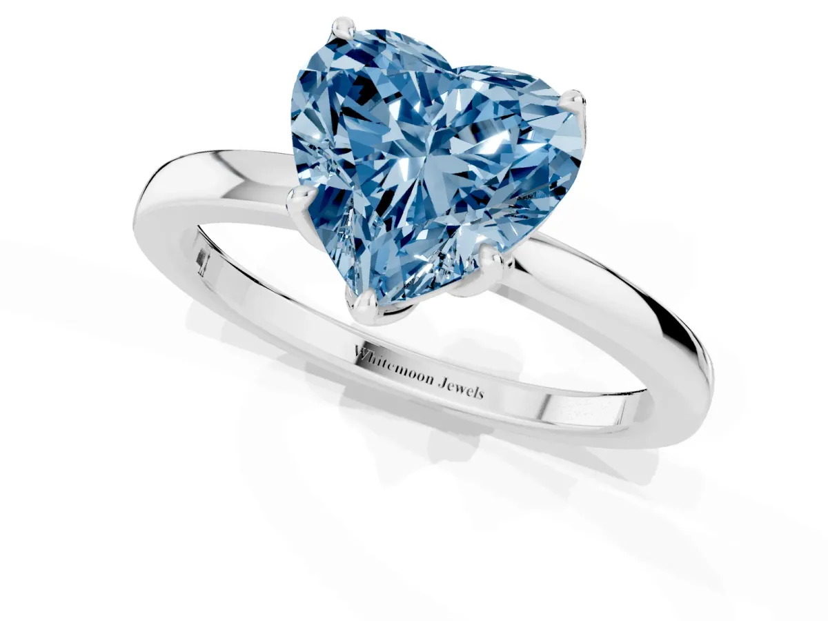 Fancy Blue Heart Cut Diamond Solitaire Ring with Thin Band and Prong Setting Silver