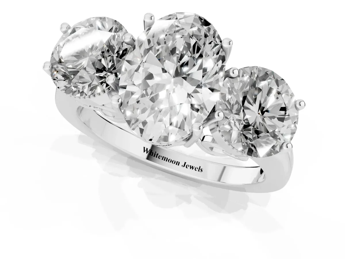 Three-Stone Oval Cut Diamond Engagement Ring with Prong Setting on a Classic Band Silver
