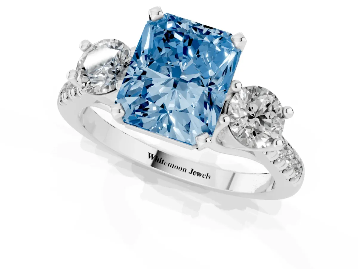 Fancy Blue Three-Stone Radiant Cut Diamond Pavé Band with Four-Prong Setting Platinum