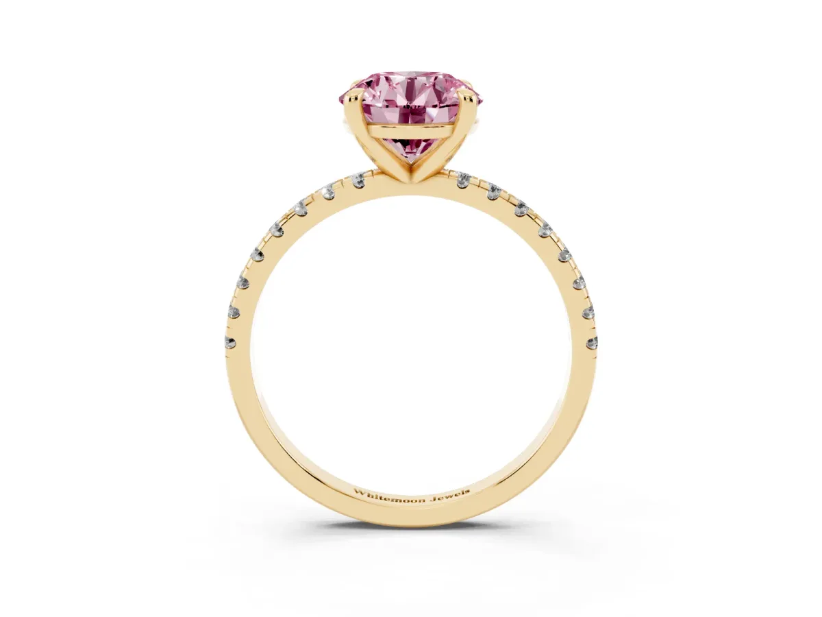 Fancy Pink Round Cut Diamond Brilliant Solitaire Ring with Pavé Band and Four-Prong Setting Yellow gold