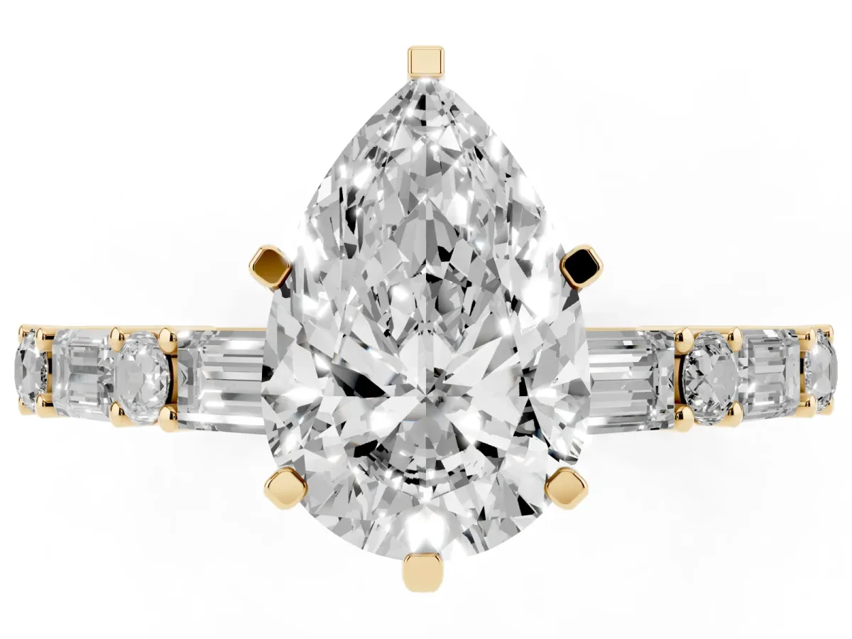 Pear Cut Diamond Solitaire with Side Baguettes and Channel Set Band Yellow gold