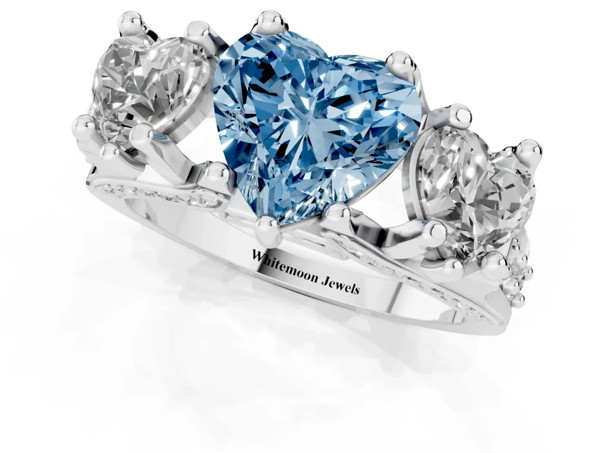Fancy Blue Heart Cut Diamond Three-Stone Ring with Channel Set Band and Four-Prong Setting Silver