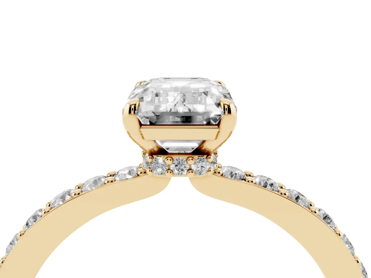 Emerald Cut Diamond Pavé Engagement Ring with Round Accents and Prong Setting Yellow gold