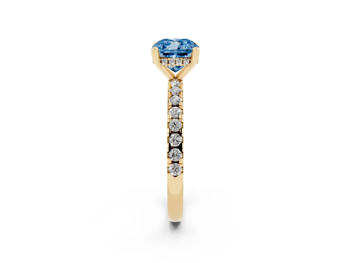 Fancy Blue Cushion Cut Diamond Solitaire Ring with Round Pavé Band and Four-Prong Setting Yellow gold
