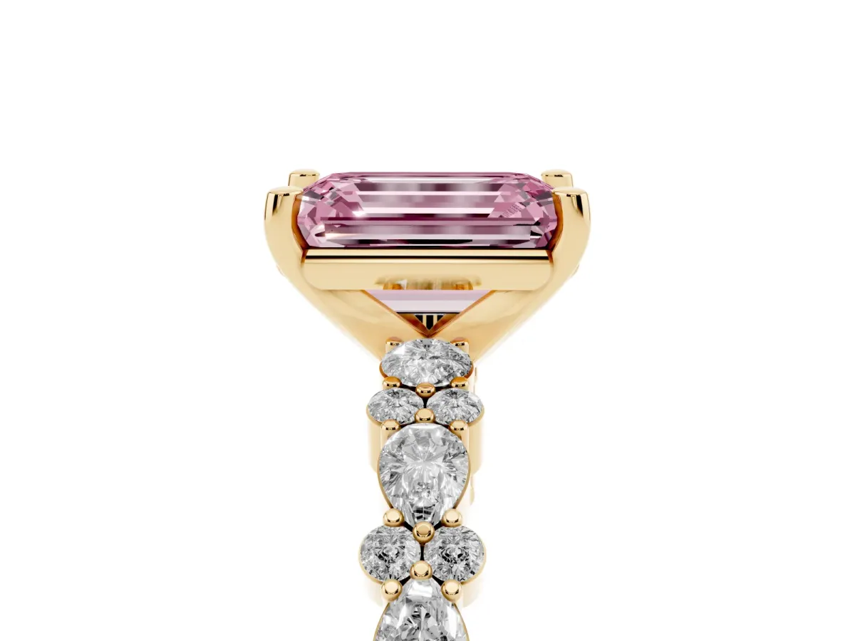 Fancy Pink Emerald Cut Diamond Side Stone Solitaire Ring with Round and Four-Prong Setting Yellow gold