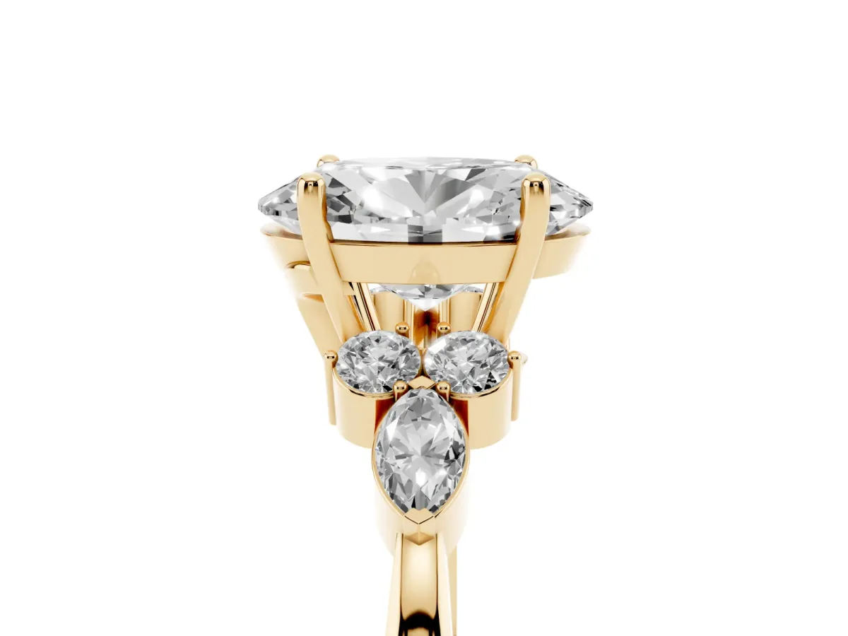 Oval Cut Brilliant Diamond Solitaire Ring with Pear Side Stones and Four-Prong Setting Yellow gold