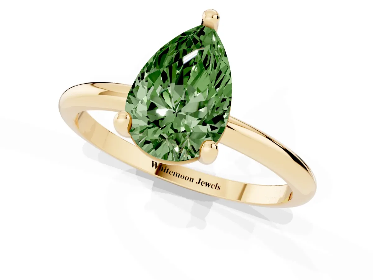 Fancy Green Pear Cut Solitaire Diamond Ring with 4-Prong Setting on a Classic Band Yellow gold