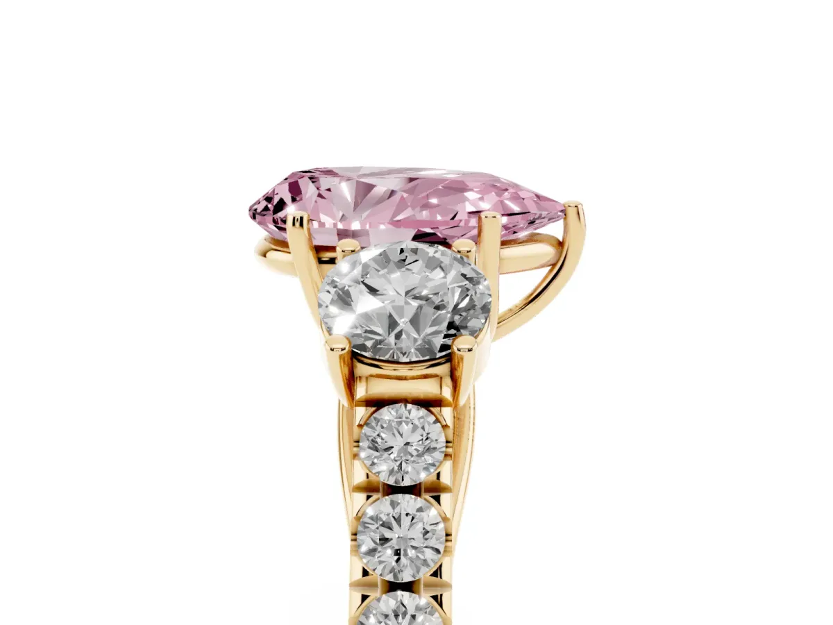 Fancy Pink Pear Cut Cut Diamond Three-Stone Ring with Round Side Stones and Pavé Band Yellow gold