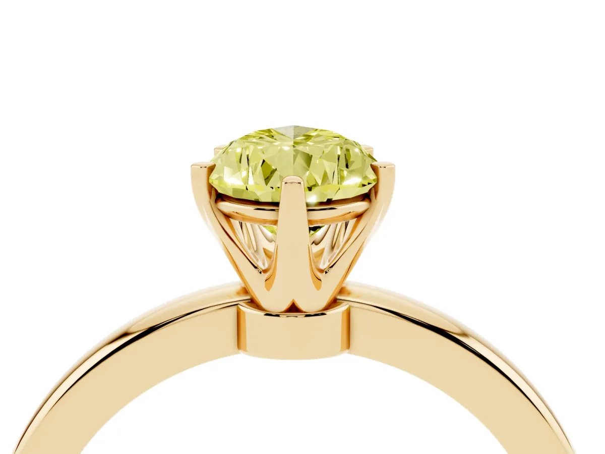 Fancy Yellow Pear Cut Solitaire Diamond Ring with Six-Prong Setting on a Classic Band Yellow gold