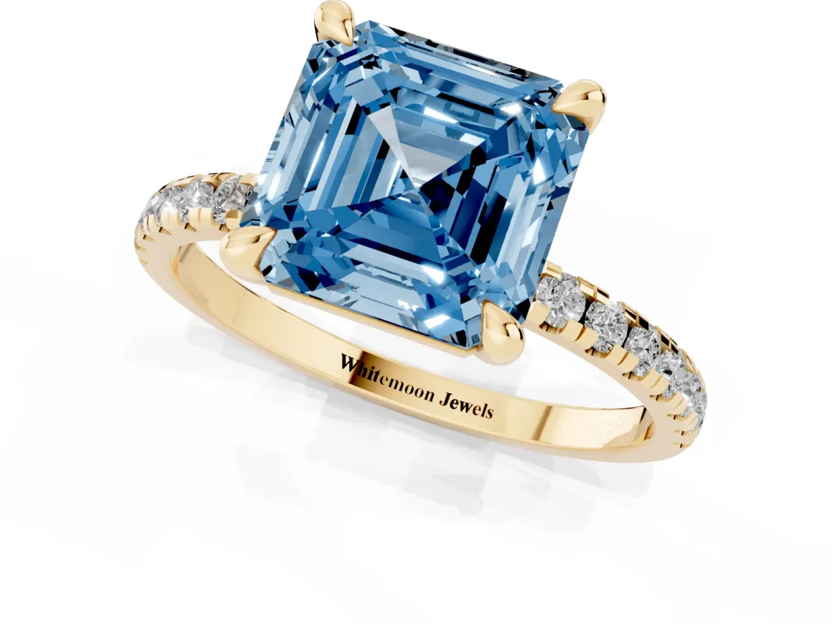 Fancy Blue Asscher Cut Diamond Brilliant Solitaire Ring with Pavé Band and Four-Prong Setting Yellow gold