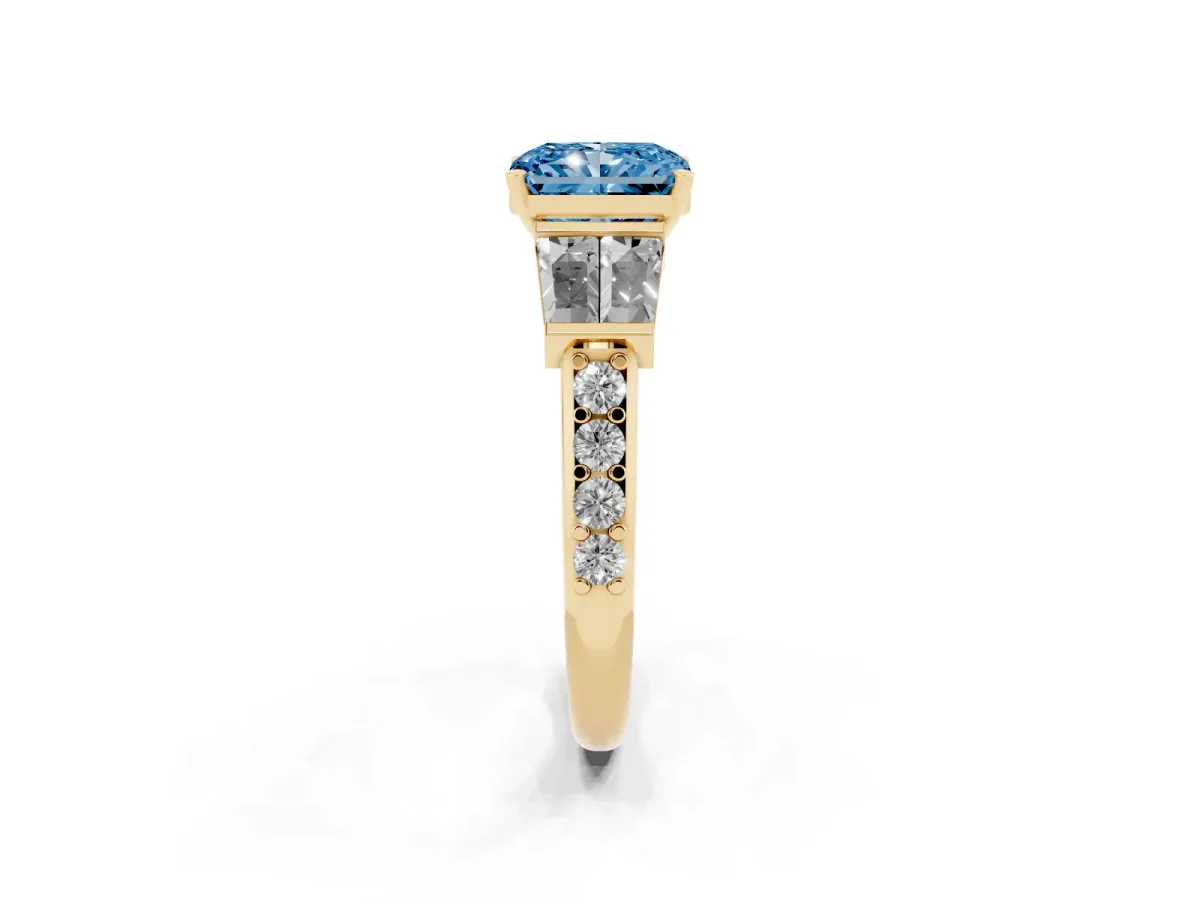 Fancy Blue Radiant Cut Diamond Engagement Ring with Baguette Side Stones and Channel Set Band Yellow gold