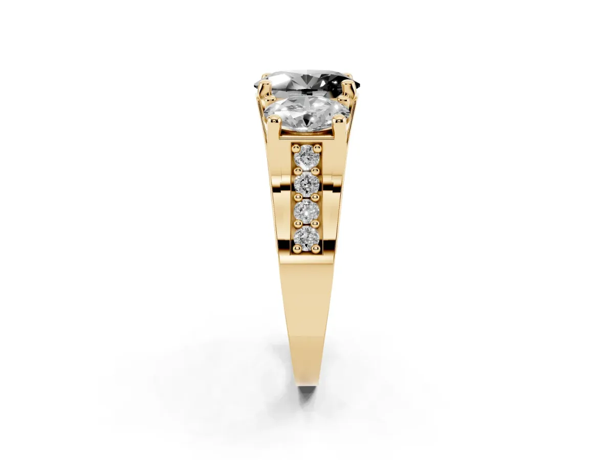 Fancy Black Oval Cut Diamond Three-Stone Ring with Channel Set Band and Four-Prong Setting Yellow gold