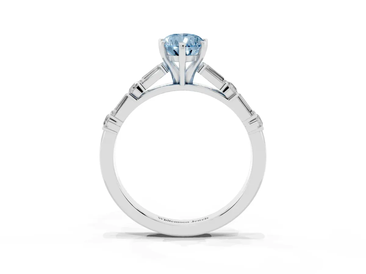Fancy Blue Pear Cut Diamond Solitaire with Side Baguettes and Channel Set Band Silver