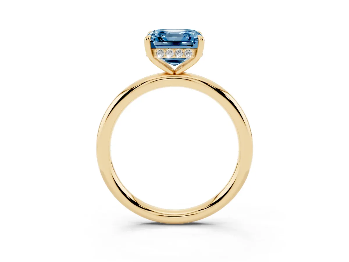 Fancy Blue Asscher Cut Diamond Solitaire Ring with Thin Band and Four-Prong Setting Yellow gold