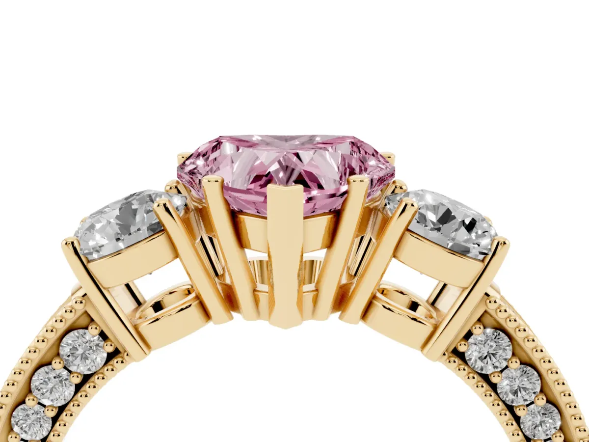 Fancy Pink Heart Cut Three-Stone Diamond Ring with Pavé Band and Four-Prong Setting Yellow gold
