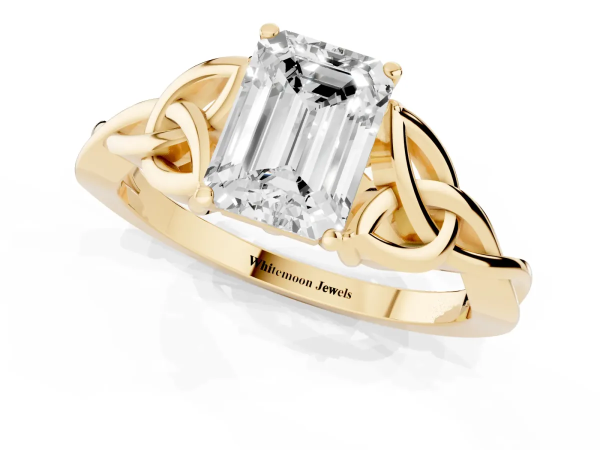 Emerald Cut Diamond Solitaire Engagement Ring with Celtic Knot Band and Four-Prong Setting Yellow gold