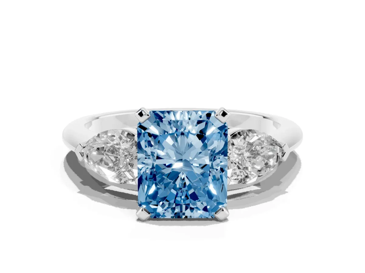 Fancy Blue Three-Stone Radiant Cut Diamond Ring with Pear Side Stones and Four-Prong Setting Platinum