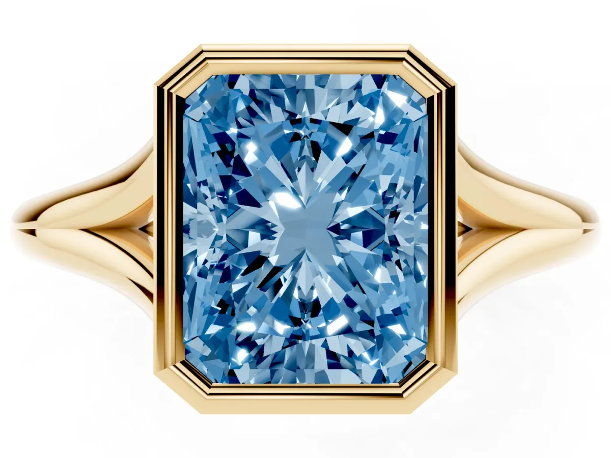 Fancy Blue Bezel Set Radiant Cut Cut Solitaire Ring with Tapered Band Yellow gold