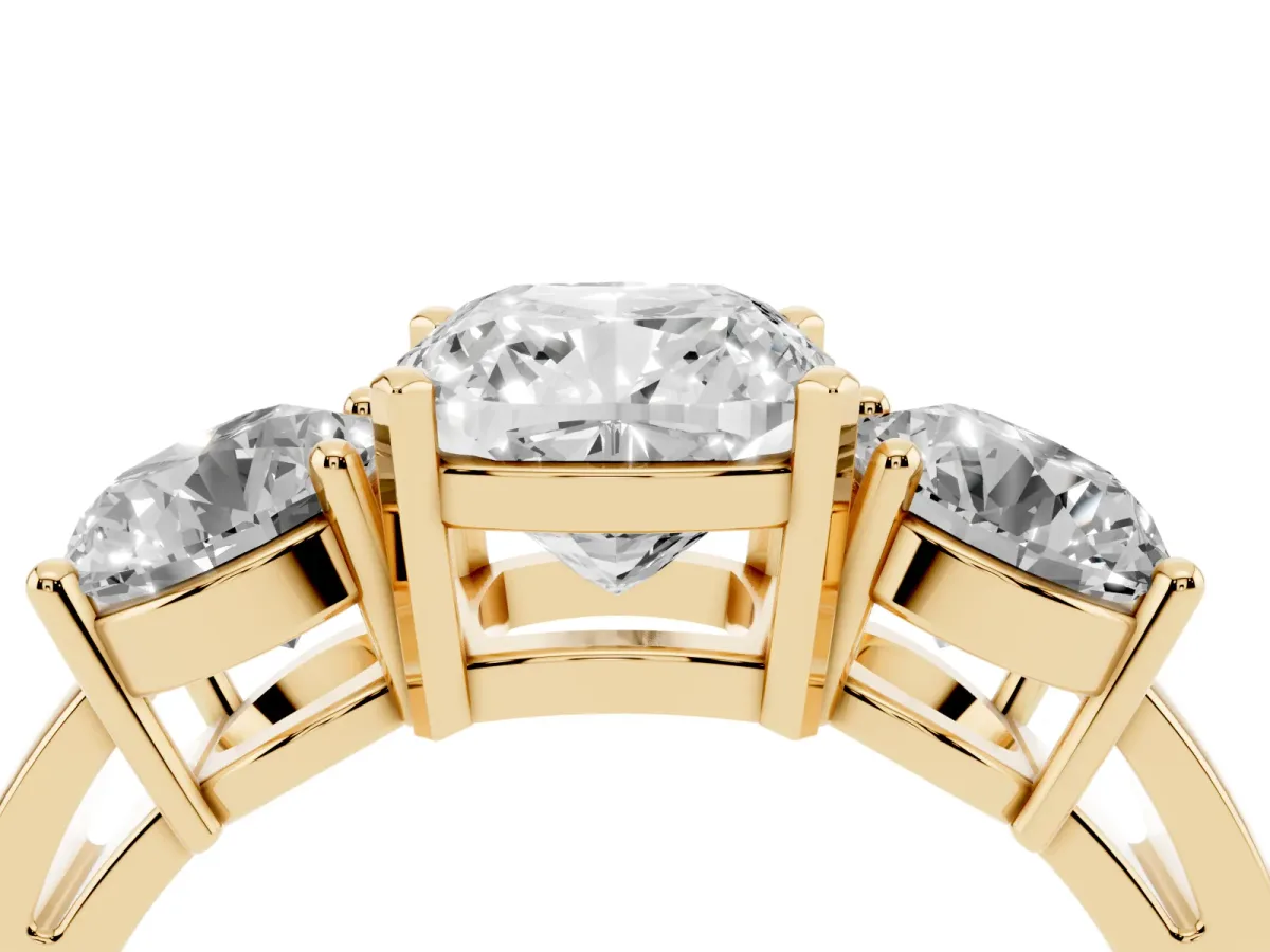 Three-Stone Cushion Cut Diamond Ring with Round Side Stones, Classic Band, and Four-Prong Setting Yellow gold
