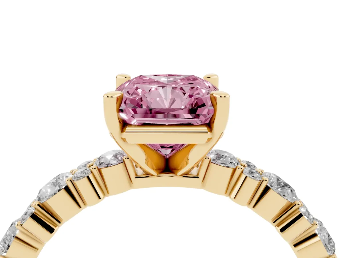 Fancy Pink Radiant Cut Diamond Side Stone Solitaire Ring with Round and Four-Prong Setting Yellow gold