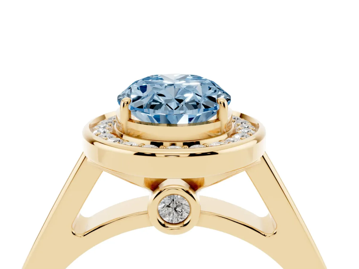 Fancy Blue Oval Cut Halo Solitaire Diamond Ring with Pave Band and Bezel Setting Yellow gold