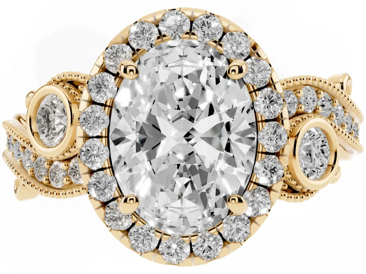 Oval Cut Halo Diamond Ring with Milgrain and Bezel Accents on a Split Shank Band Yellow gold