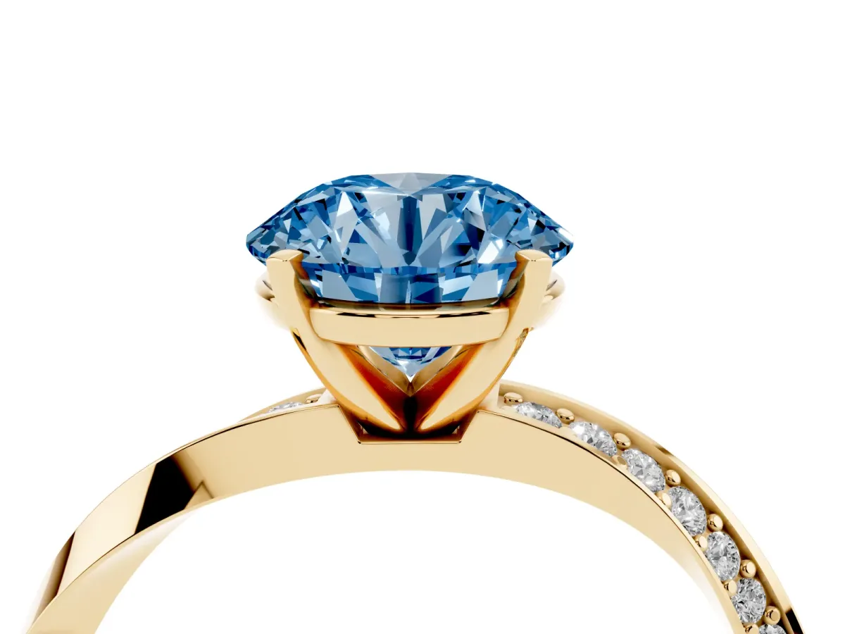 Fancy Blue Round Cut Diamond Engagement Ring with Side Stone Accents and Four-Prong Setting Yellow gold