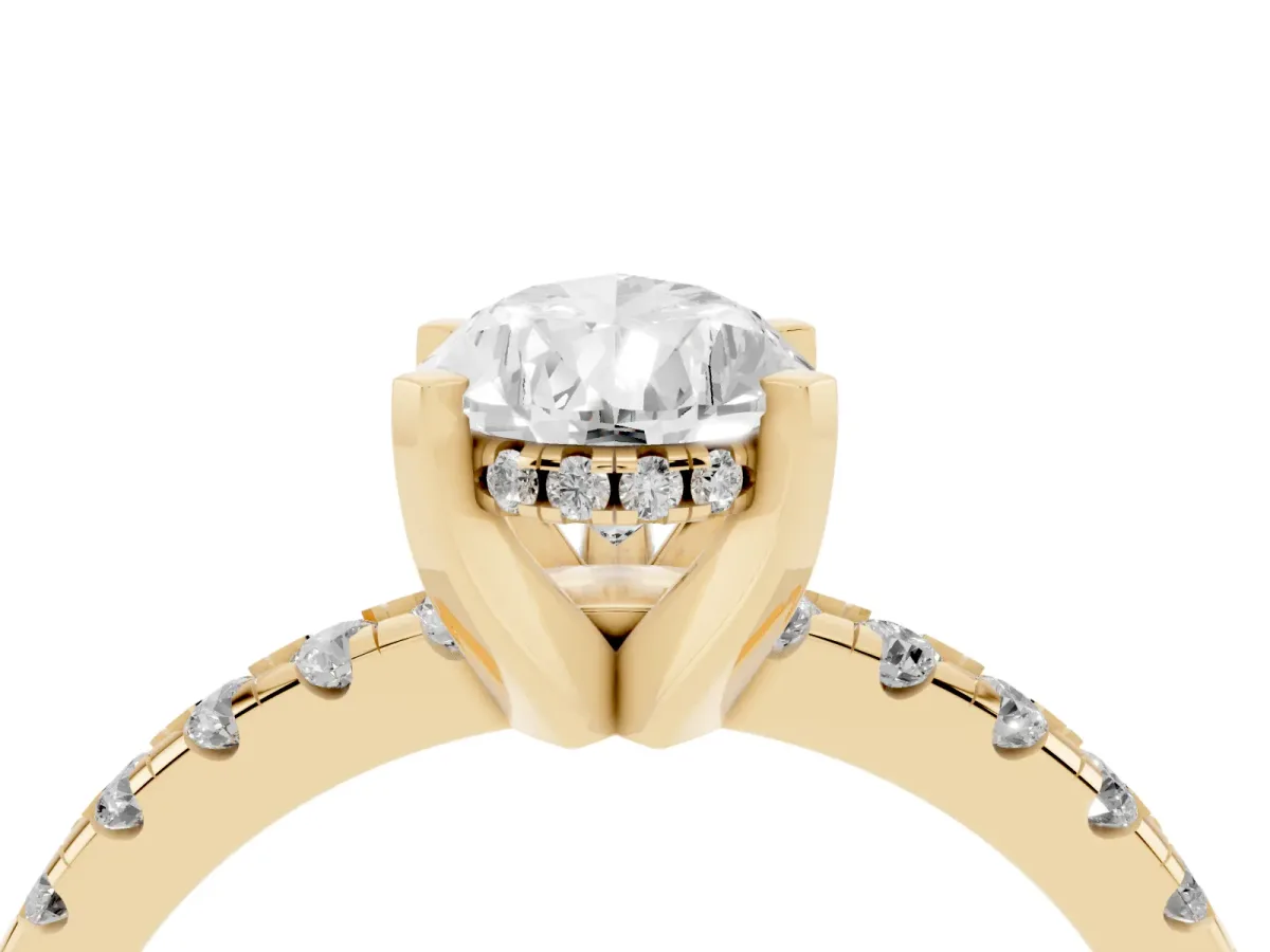 Pear Cut Diamond Solitaire Ring with Round Pavé Band and Four-Prong Setting Yellow gold
