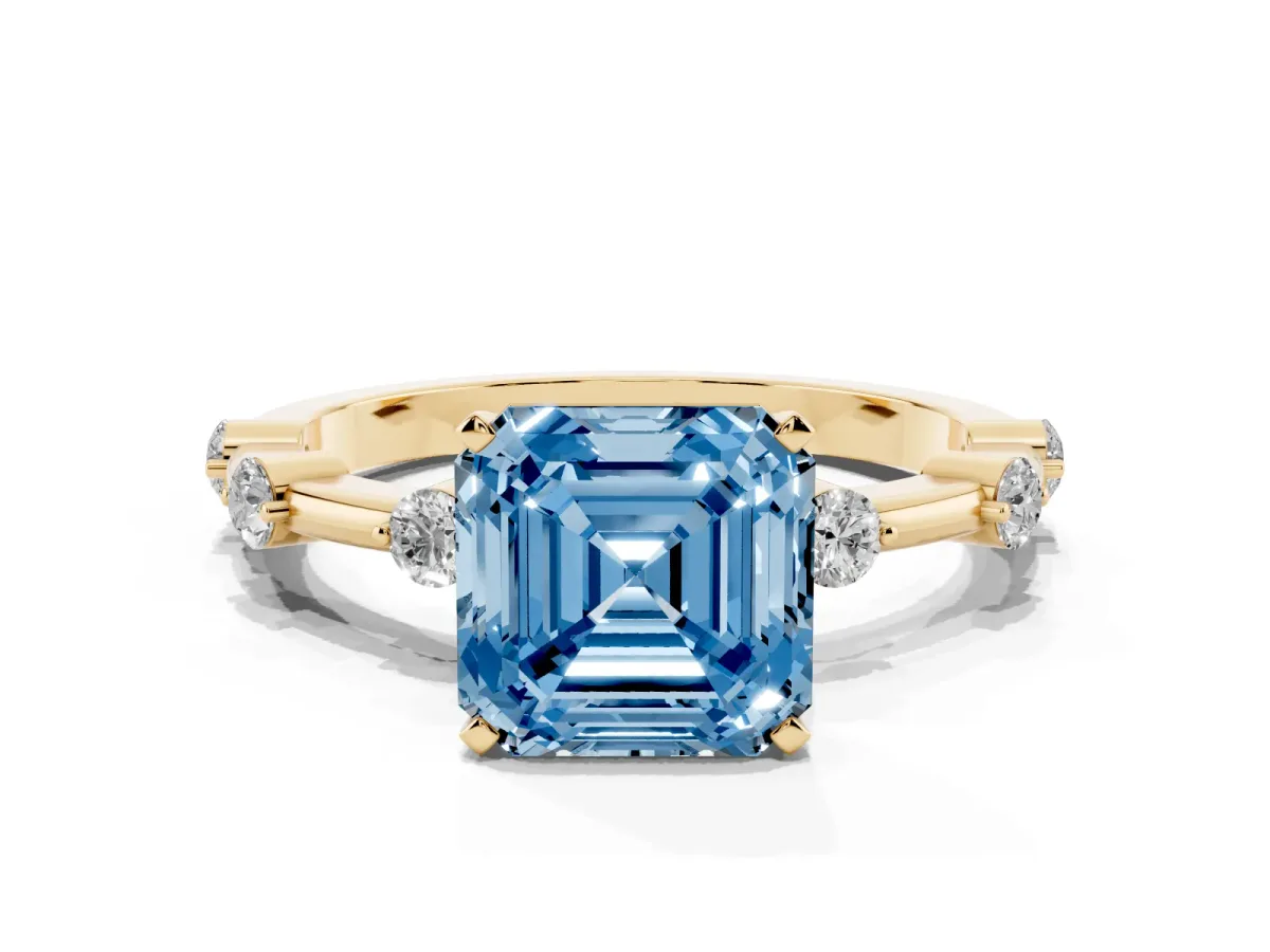 Fancy Blue Asscher Cut Solitaire Diamond Ring with Bezel Set Side Stones and Prong Setting Yellow gold