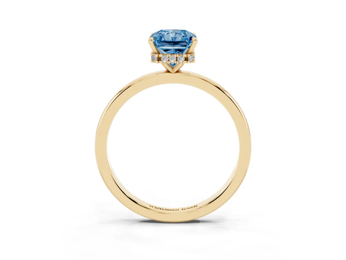 Fancy Blue Radiant Cut Solitaire Engagement Ring with Cathedral Band and Four-Prong Setting Yellow gold