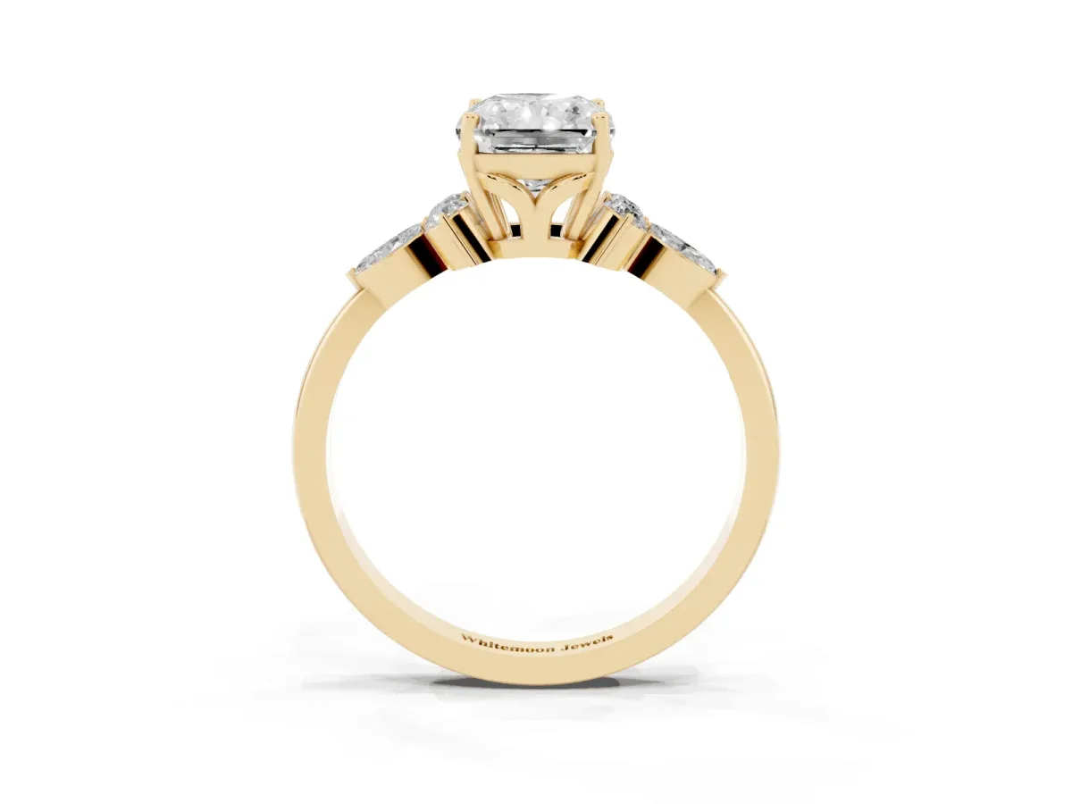Radiant Cut Brilliant Diamond Solitaire Ring with Pear Side Stones and Four-Prong Setting Yellow gold