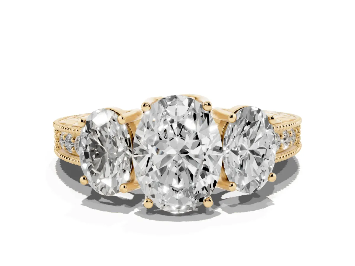 Three-Stone Oval Cut Cut Milgrain Pavé Engagement Ring Yellow gold