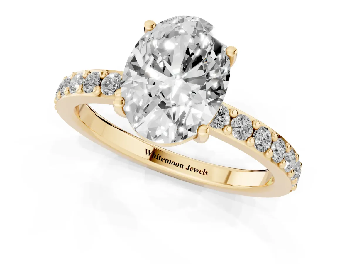 Oval Cut Cut Diamond Solitaire with Pave Band and Four-Prong Setting Yellow gold