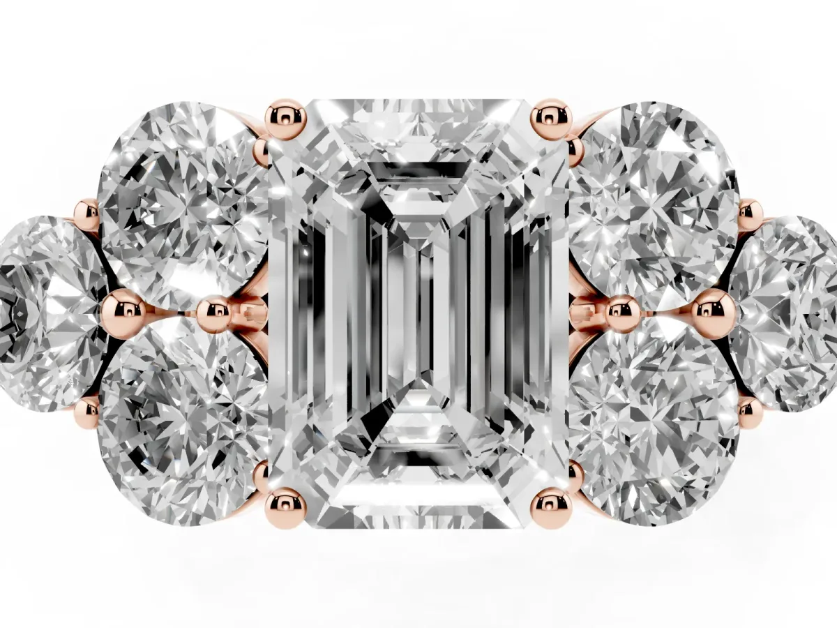 Emerald Cut Cut Diamond Cluster Ring with Round Accent Stones and Prong Setting on a Classic Band Rose gold