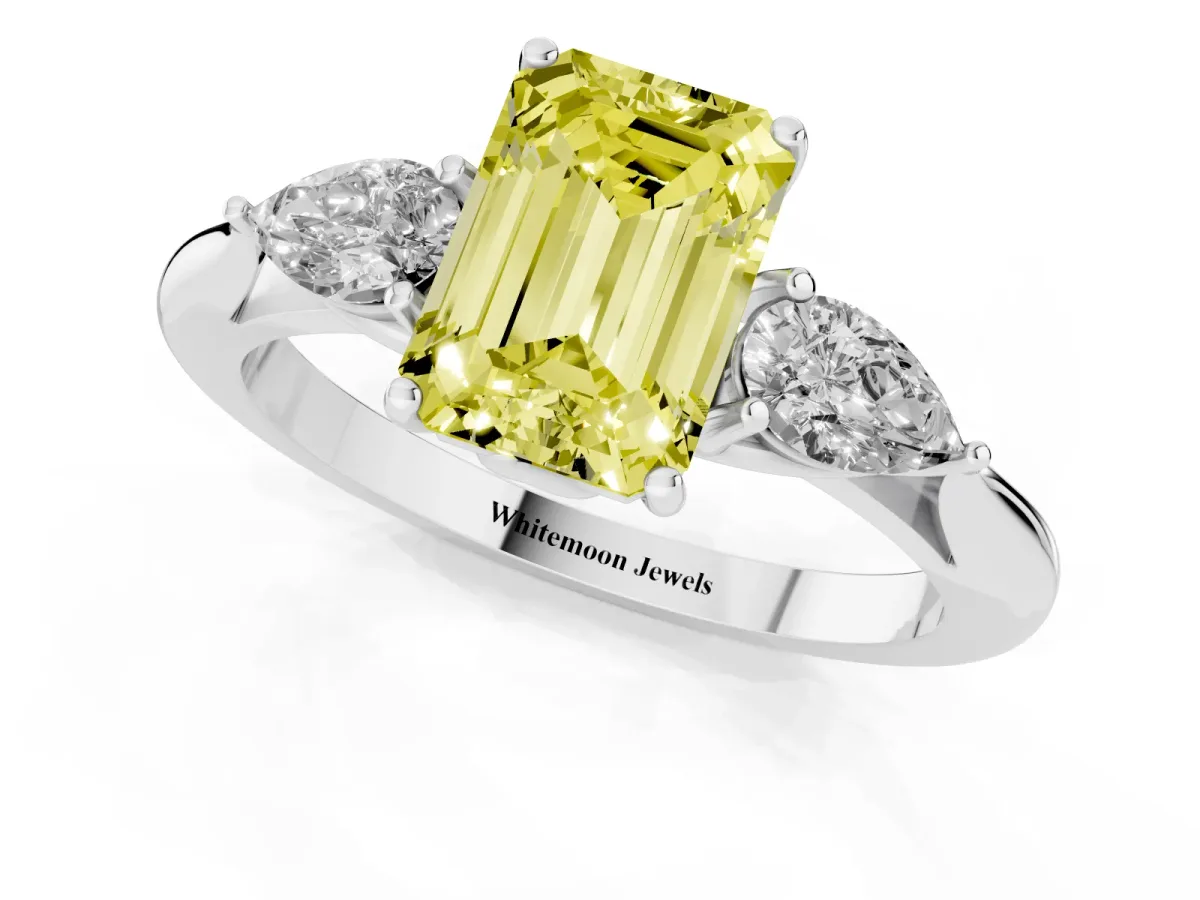 Fancy Yellow Three-Stone Emerald Cut Brilliant Diamond Solitaire Ring with Tapered Band and Four-Prong Setting Platinum