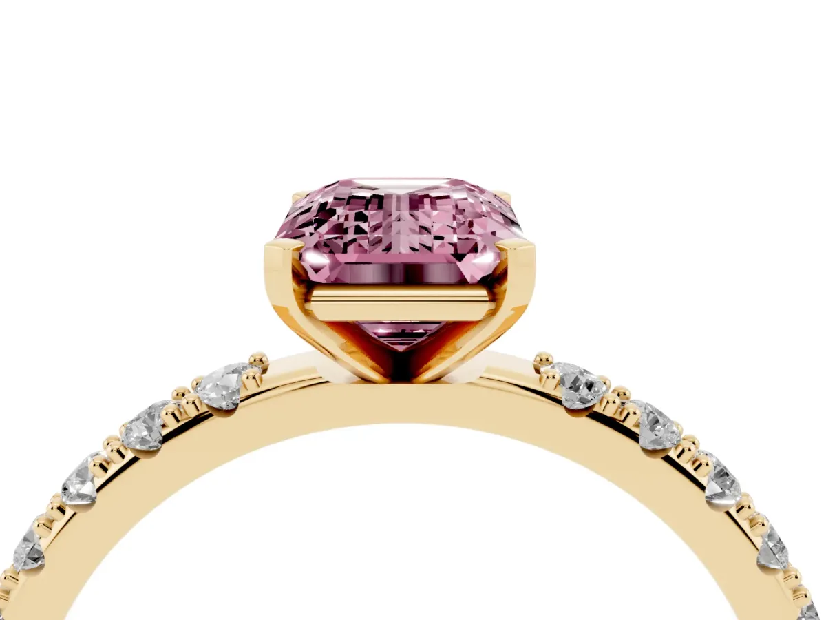 Fancy Pink Emerald Cut Diamond Solitaire Pavé Band with Four-Prong Setting Yellow gold