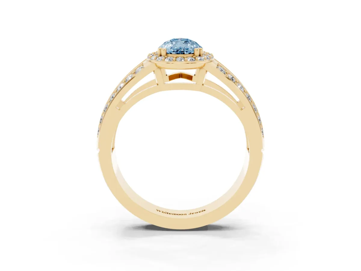 Fancy Blue Pear Cut Diamond Halo Ring with Split Shank Pavé Band and Four-Prong Setting Yellow gold