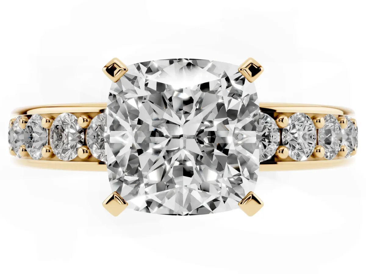 Cushion Cut Diamond Engagement Ring with Channel Set Round Band and Prong Setting Yellow gold