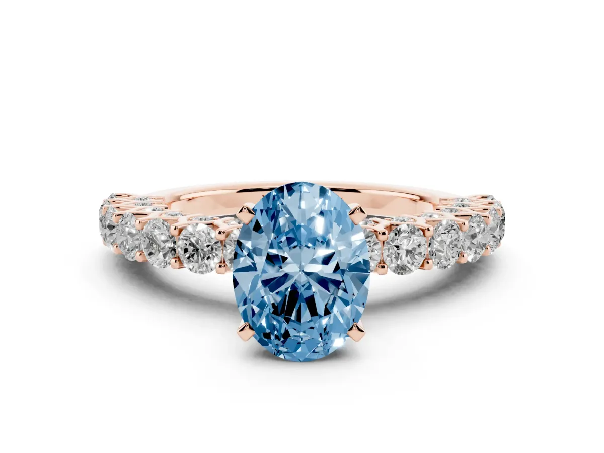Fancy Blue Oval Cut Diamond Solitaire Ring with Shared Prong Pavé Band and Four-Prong Setting Rose gold