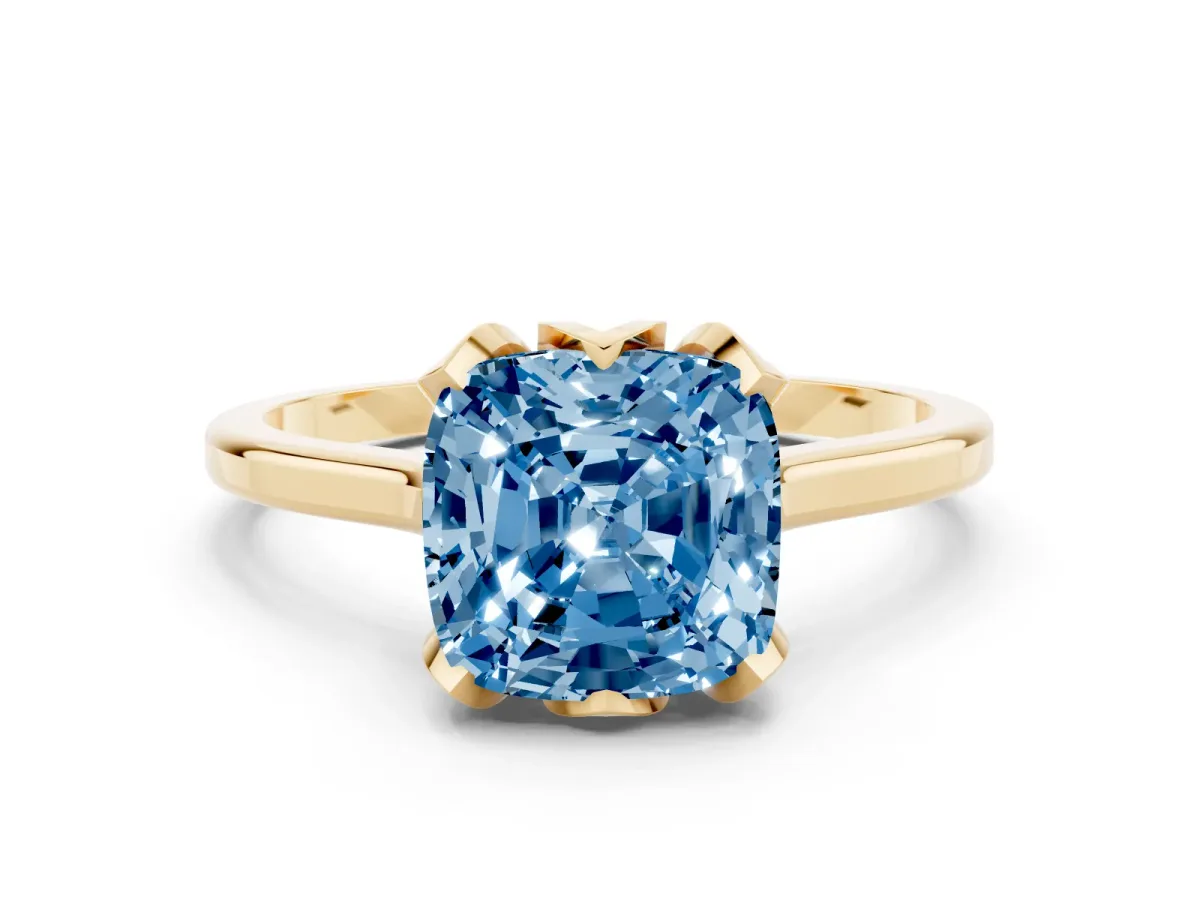 Fancy Blue Cushion Cut Diamond Solitaire Ring with Flower Prong Setting and Classic Band Yellow gold