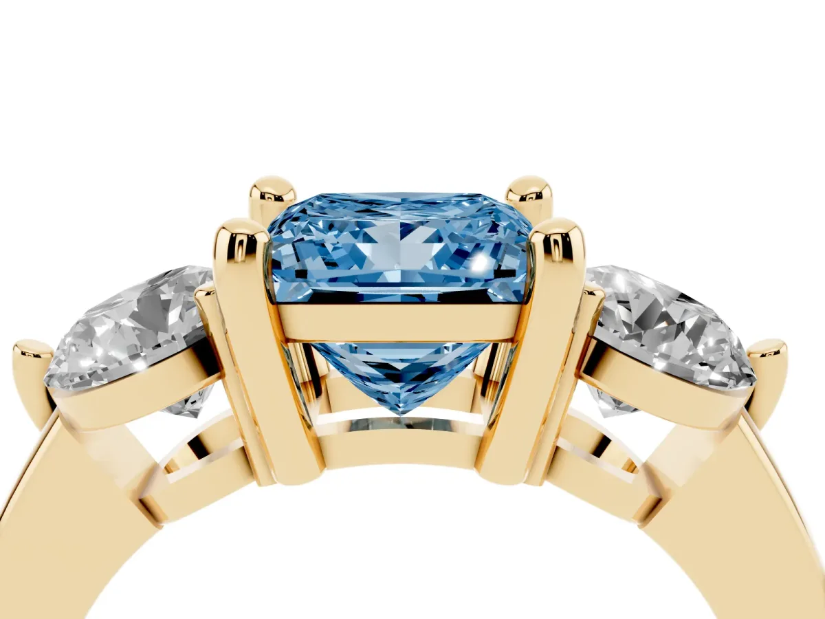 Fancy Blue Three-Stone Princess Cut Brilliant Cut Solitaire Ring with Prong Setting on a Classic Band Yellow gold