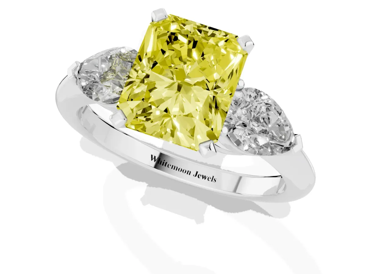 Fancy Yellow Three-Stone Radiant Cut Diamond Ring with Pear Side Stones and Four-Prong Setting Silver