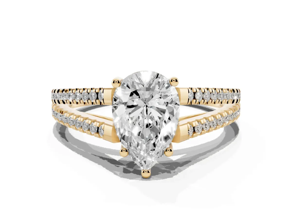 Pear Cut Diamond Solitaire Engagement Ring with Split Shank Pavé Band Yellow gold