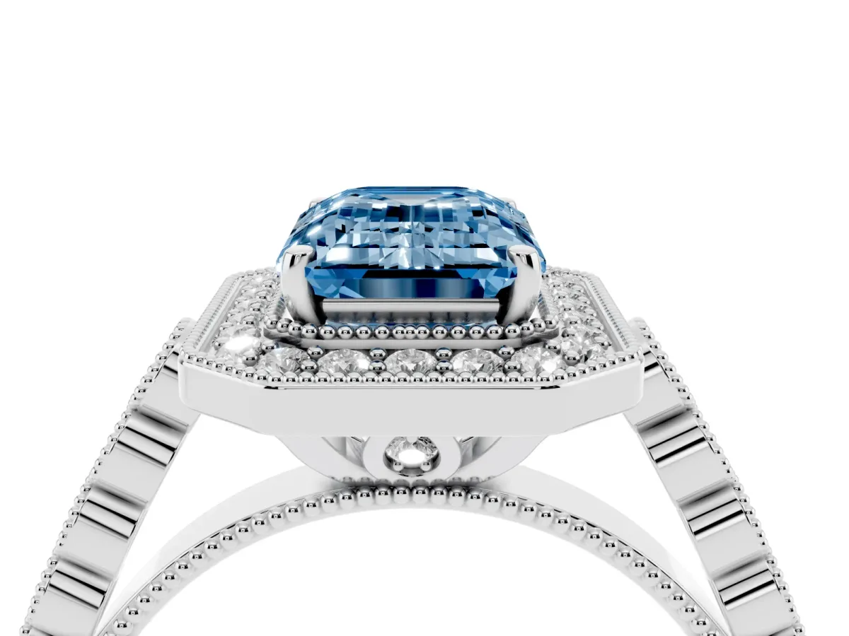 Fancy Blue Emerald Cut Halo Milgrain Solitaire with Bezel Set Side Stones and Pave Band White gold