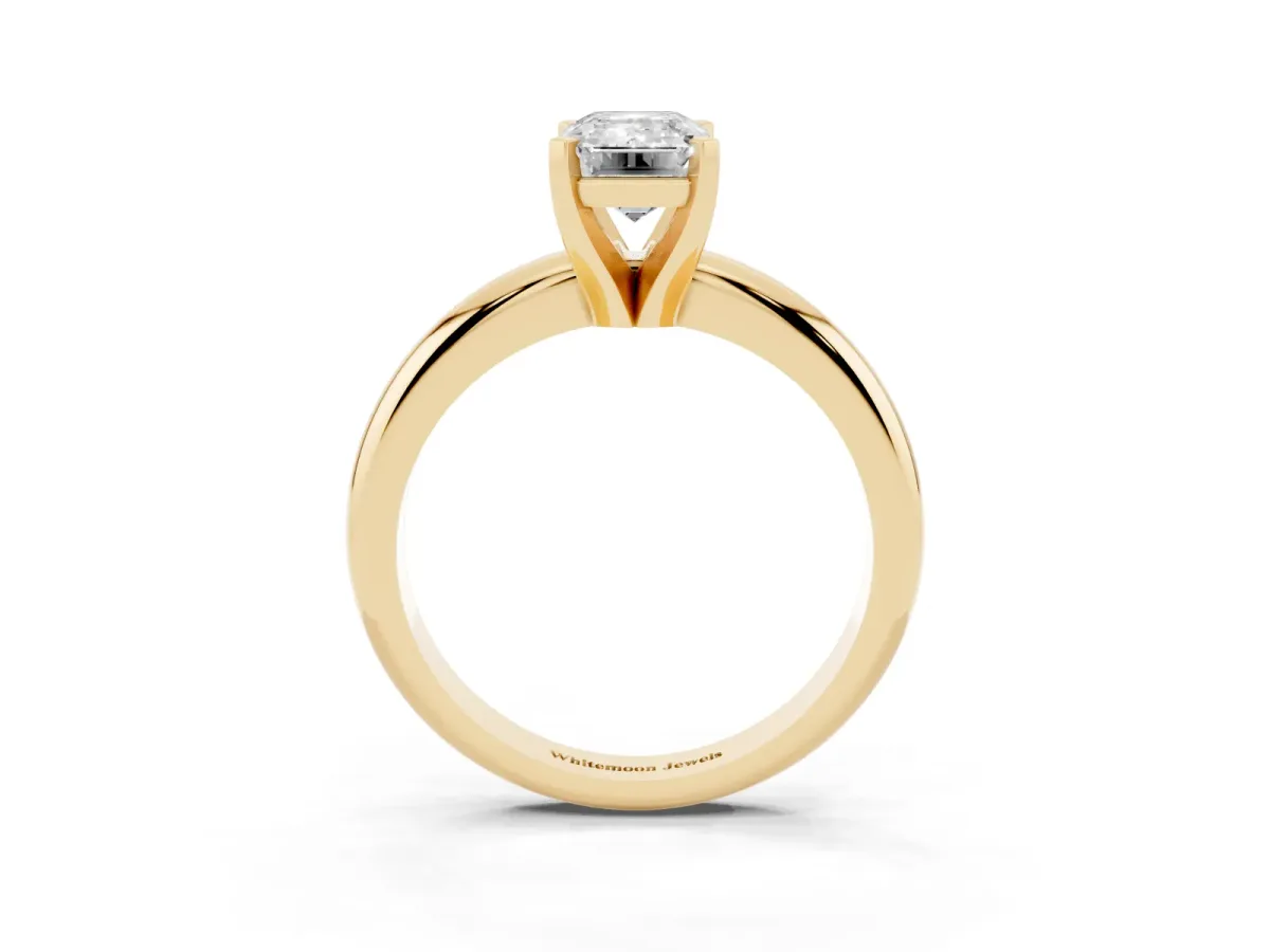 Emerald Cut Diamond Solitaire Engagement Ring with Round Band and Four-Prong Setting Yellow gold